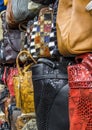 Bags, suitcases, purses and scarfs in shop of leather goods and accessories