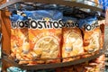 Bags of Tostitos brand corn tortilla chips snacks for sale