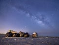 Bags with trash at the beach under the night sky full of stars Royalty Free Stock Photo