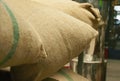 Bags in the warehouse on the racks. Coffee arabica and rice Royalty Free Stock Photo