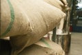 Bags in the warehouse on the racks. Coffee arabica, rice. Royalty Free Stock Photo