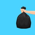 Bags waste, garbage black plastic bag in hand isolated on blue background, bin bag plastic black for disposal garbage, icon bag Royalty Free Stock Photo