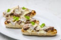 baguette baked with meat, onion and cheese