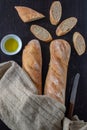 baguette bread loaves in paper bag on wooden background Royalty Free Stock Photo