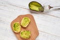 Baguette, bruschetta, canapes with avocado on a light wooden background Royalty Free Stock Photo