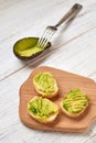 Baguette, bruschetta, canapes with avocado on a light wooden background Royalty Free Stock Photo