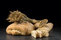 Baguette and ciabatta, bread on dark wooden table. Wheat and fresh mixed breads on black background. Food Royalty Free Stock Photo