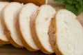 Baguette. French baguette slices on a wooden table. Breakfast bread. Royalty Free Stock Photo