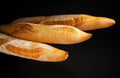 Baguette. Fresh bread isolated on black background