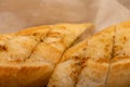 Baguette with garlic paste cut into pieces, close-up, selective focus Royalty Free Stock Photo