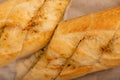 Baguette with garlic paste cut into pieces, close-up, selective focus Royalty Free Stock Photo