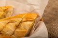 Baguette with garlic paste cut into pieces, close-up, selective focus Royalty Free Stock Photo