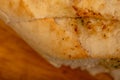 Baguette with garlic paste cut into pieces, close-up, selective focus Royalty Free Stock Photo