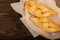 Baguette with garlic paste cut into pieces, close-up, selective focus Royalty Free Stock Photo