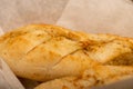 Baguette with garlic paste cut into pieces, close-up, selective focus Royalty Free Stock Photo