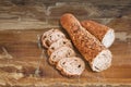 Sliced Elongated Integral Baguette Bread Loaf Set On Old Weathered Cracked Flaky Picnic Table Grunge Surface Royalty Free Stock Photo