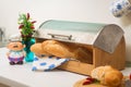 Baguette, lying in a breadbox