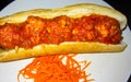 Baguette and meatballs in tomato sauce gravy with shred carrots, called Nom pang