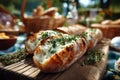 Baguette with melted cheese and herbs served on picnic table Royalty Free Stock Photo
