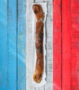 Baguette over a table with the colors of France flag.