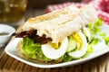 Baguette sandwich with fried bacon and eggs Royalty Free Stock Photo