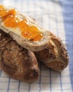 Baguette with seeds at table with butter