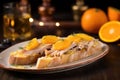 baguette slice topped with duck confit and orange sauce