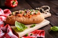 Baguette stuffed with minced meat, tomato sauce, bell pepper, beans, onion, garlic and cheese Royalty Free Stock Photo