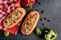 Baguette stuffed with minced meat, tomato sauce, bell pepper, beans, onion, garlic and cheese Royalty Free Stock Photo