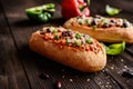 Baguette stuffed with minced meat, tomato sauce, bell pepper, beans, onion, garlic and cheese Royalty Free Stock Photo