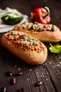 Baguette stuffed with minced meat, tomato sauce, bell pepper, beans, onion, garlic and cheese Royalty Free Stock Photo