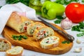 Baguette stuffed with a salad of baked chicken, cheese and fresh vegetables Royalty Free Stock Photo