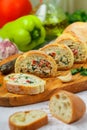 Baguette stuffed with a salad of baked chicken, cheese and fresh vegetables Royalty Free Stock Photo