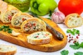 Baguette stuffed with a salad of baked chicken, cheese and fresh vegetables Royalty Free Stock Photo