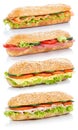 Baguette sub sandwiches with salami ham cheese salmon fish stack Royalty Free Stock Photo