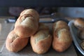 Baguettes bread on wooden shelf. Homemade pastries. Fresh bread in the bakery. Royalty Free Stock Photo