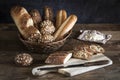 Baguettes and rolls in basket and board. Royalty Free Stock Photo