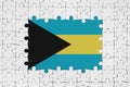 Bahamas flag in frame of white puzzle pieces with missing central part