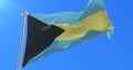 Bahamas flag waving at wind in slow with blue sky, loop