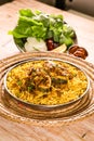 Bahari Kanaad biryani or fish biriyani served in dish isolated on table top view of arab food