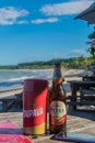 BAHIA, BRAZIL - June 27, 2019: Close view of a cold bottle of beer with water drops, near a menu and a smartphone in a Royalty Free Stock Photo