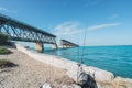 Bahia Honda State Park in the Florida Keys - fishing poles in front of old overseas highway  bridge on sunny day Royalty Free Stock Photo