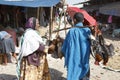 Bahir Dar, Ethiopia, February 14 2015: A woman buys on a market a chicken from a dealer