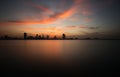 Bahrain skyline and beautiful clouds with reflection after sunset Royalty Free Stock Photo