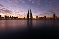 Bahrain skyline during sunrise. A long exposure image showing the streaks of clouds