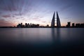 Bahrain skyline during sunrise. A long exposure image showing the streaks of clouds