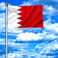 Bahrain waving flag against blue sky