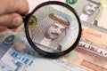 Bahraini dinar in a magnifying glass Royalty Free Stock Photo