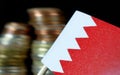 Bahraini flag waving with stack of money coins Royalty Free Stock Photo