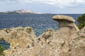 Baia Sardinia Coastal View with Naturally Sculpted Rocks and Distant Island of Isola Caprera : Baia Sardinia, Gallura, Sardinia, I Royalty Free Stock Photo